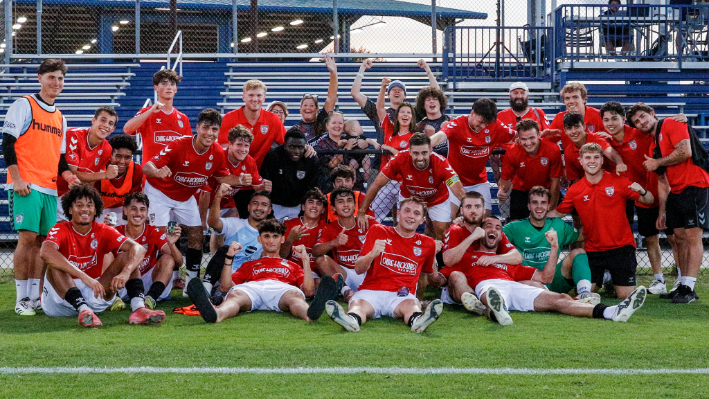Hickory FC team and fans at UNC-Wilmington posing for a group picture after a win against Port City on June 17, 2026.