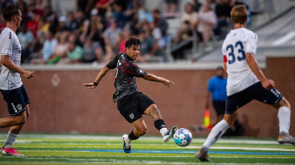 Hickory FC player, Bautista Schmidt, with a hard pass during the match with Charlotte Independence FC on June 27, 2026 at Moretz Stadium.