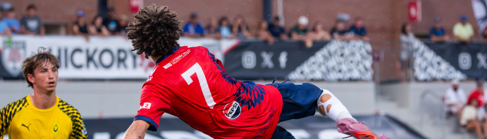 Hickory FC player, Amare Lucas midair with an attempted scissor kick during match against Appalachian FC on July 3, 2026.